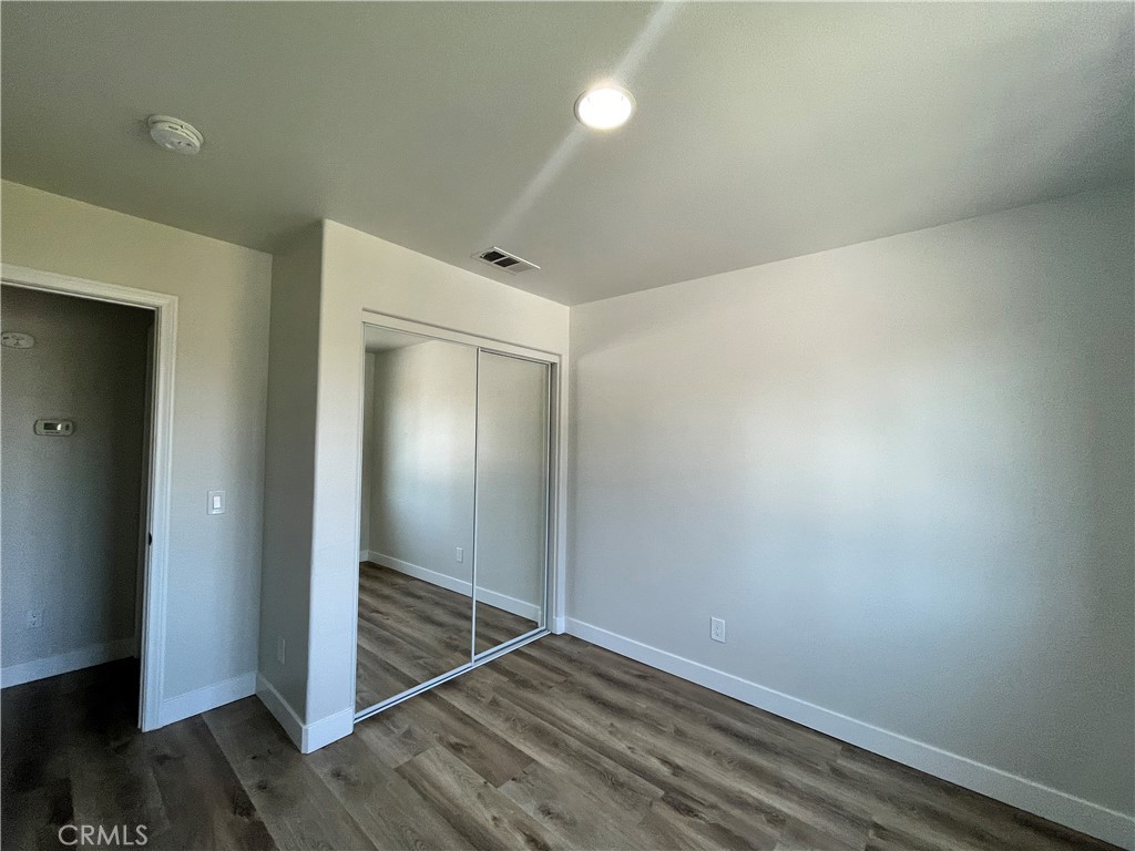 1004 South Riverside Avenue, Unit A3 Rialto, CA 92376 - Photo 6 of 10 wooden floor in an empty room