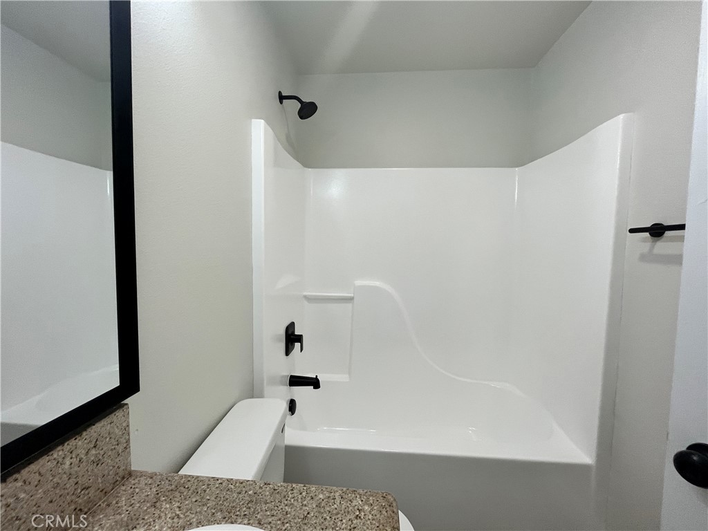 1004 South Riverside Avenue, Unit A3 Rialto, CA 92376 - Photo 8 of 10 a bathroom with a shower