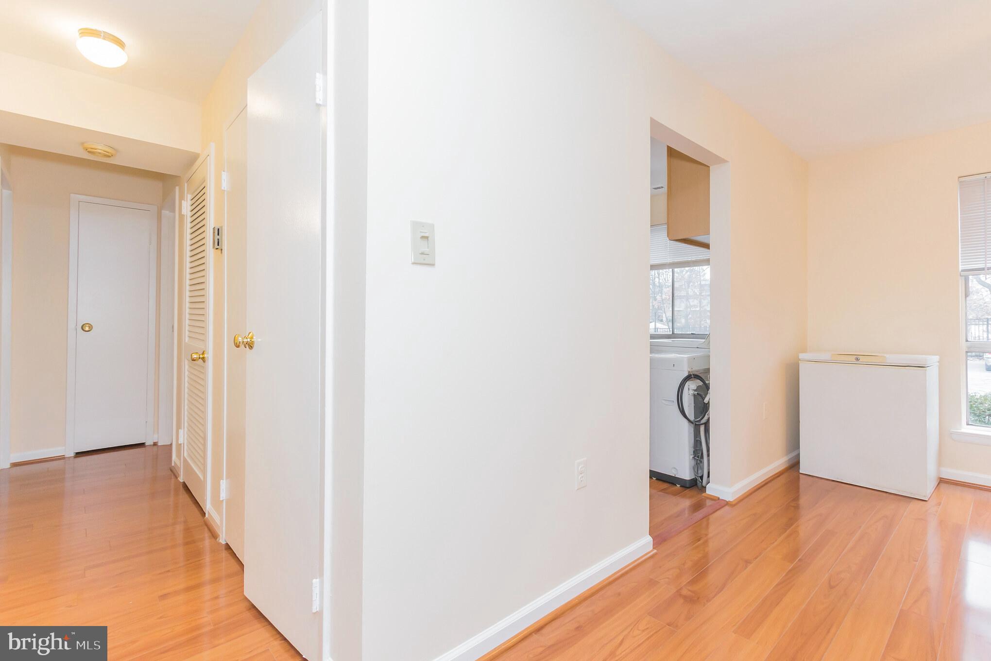 3974 Bel Pre Road, Unit 39744 Silver Spring, MD 20906 - Photo 11 of 31 New Laminate Flooring in Hallway, LR, DR, Kitchen