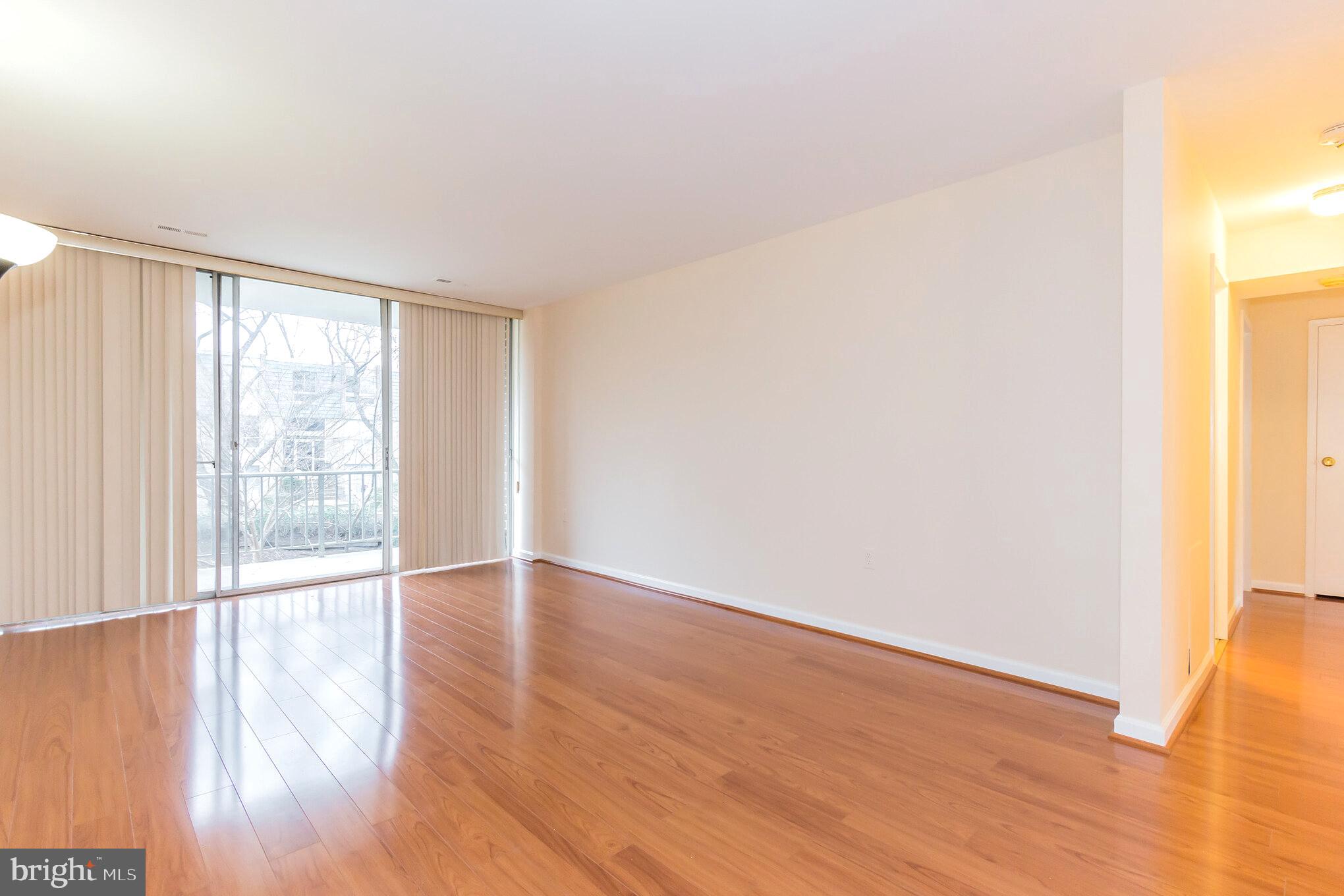3974 Bel Pre Road, Unit 39744 Silver Spring, MD 20906 - Photo 4 of 31 Spacious Living Room with Walk-Out to Balcony