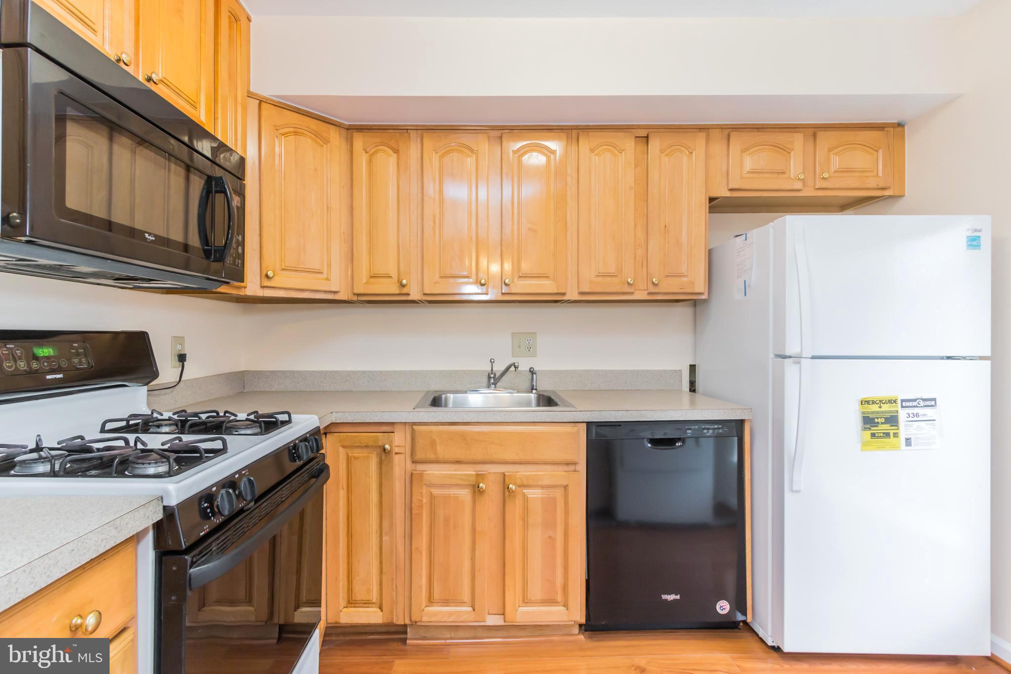 3974 Bel Pre Road, Unit 39744 Silver Spring, MD 20906 - Photo 8 of 31 Kitchen with Gas Range and New Refrigerator