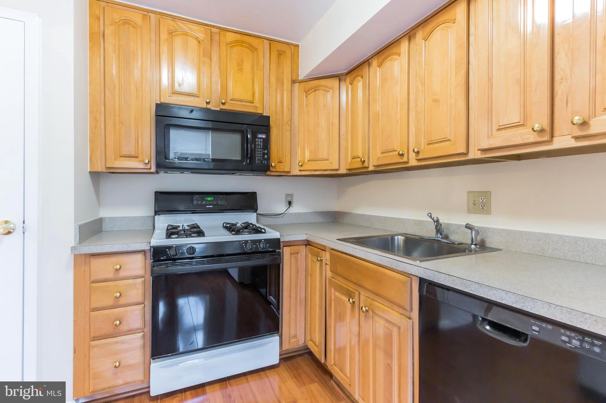 3974 Bel Pre Road, Unit 39744 Silver Spring, MD 20906 - Photo 9 of 31 Cabinets 2 yrs old; corner cabinet shelf revolves