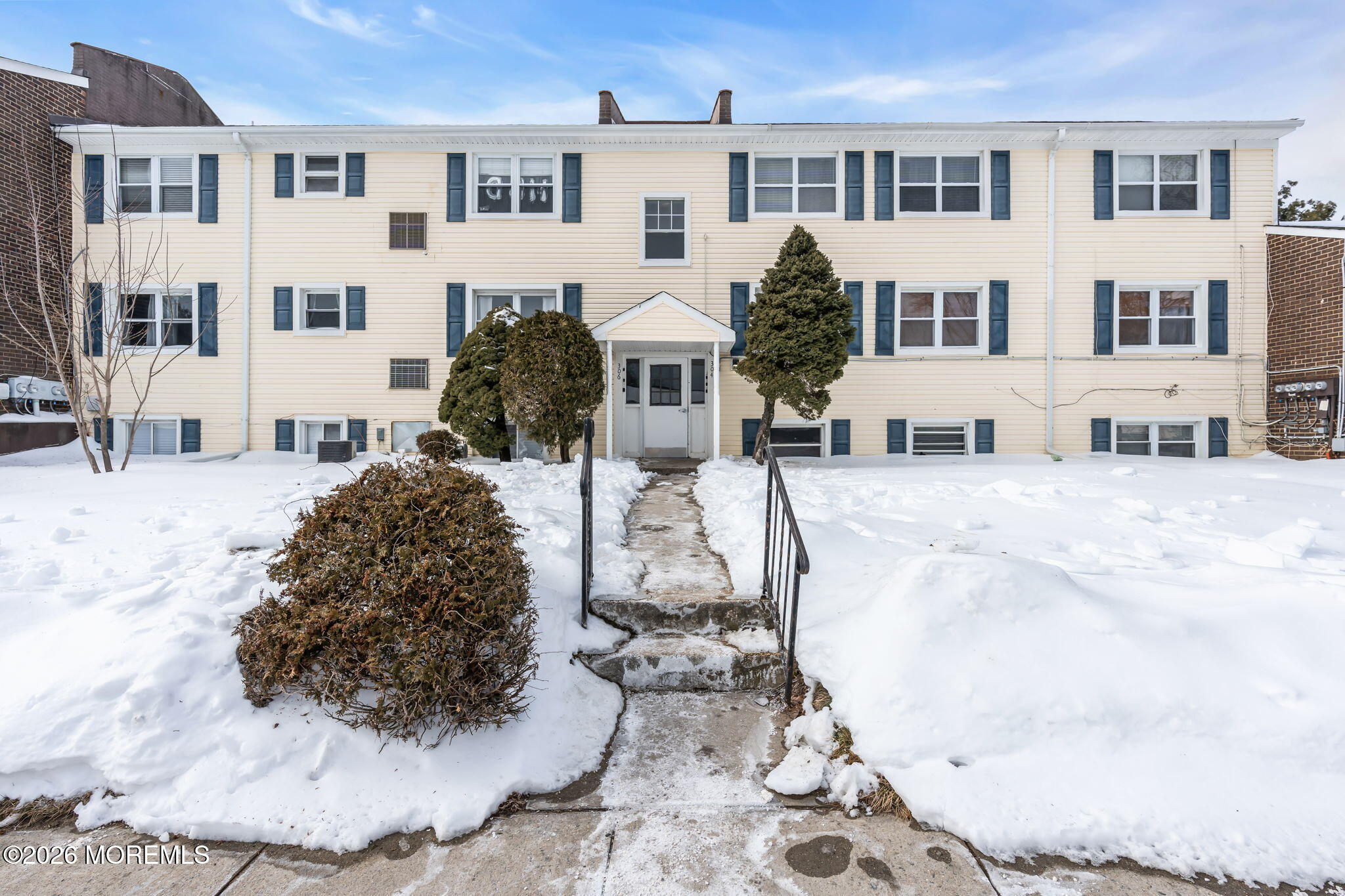 306 Sawmill Road, Unit 182 Brick, NJ 08724 - Photo 11 of 24 a view of a white building among the side of a street