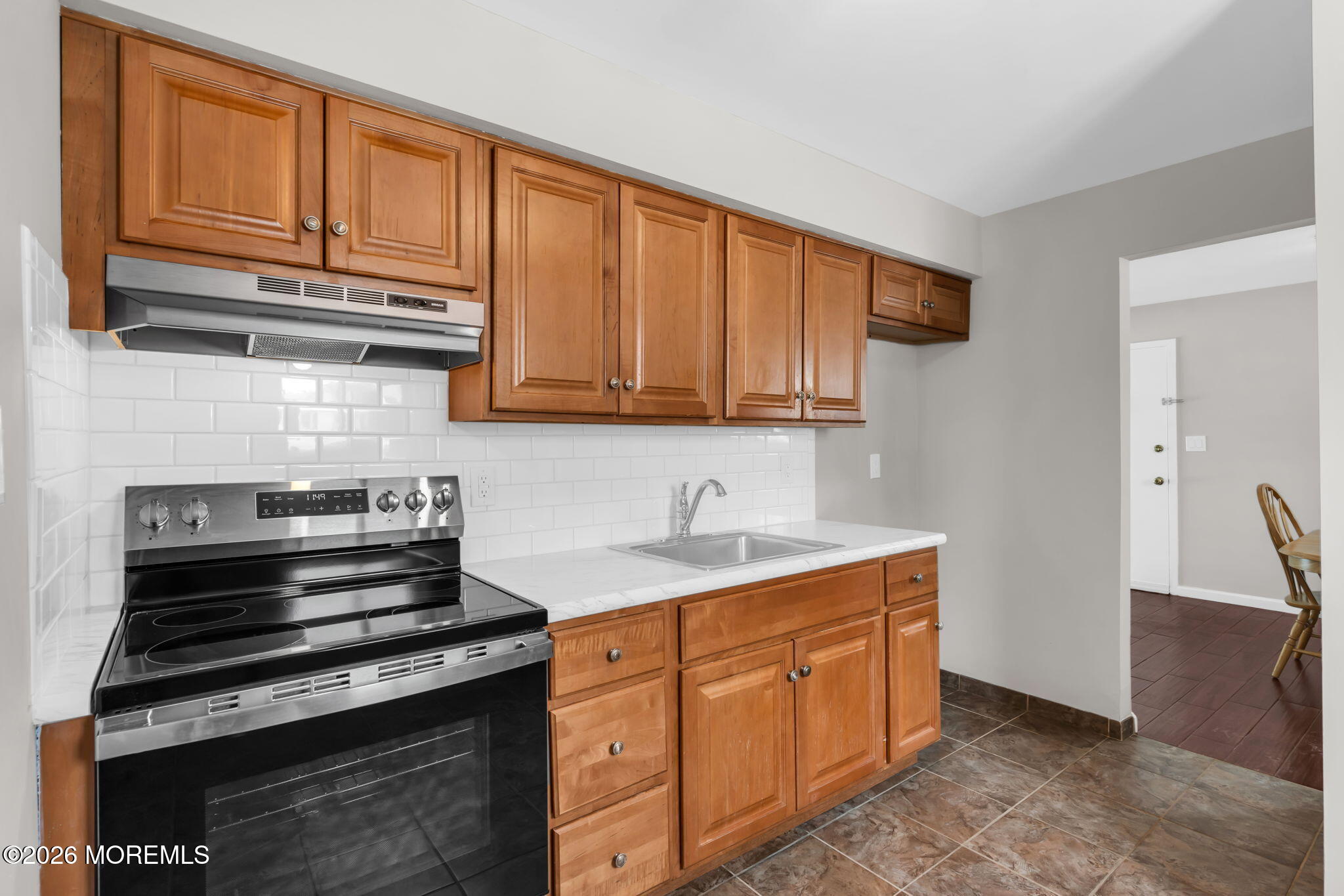 306 Sawmill Road, Unit 182 Brick, NJ 08724 - Photo 15 of 24 a kitchen with stainless steel appliances granite countertop a stove and a sink
