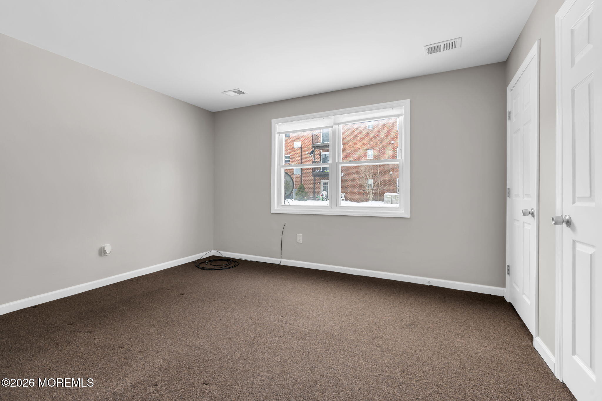 306 Sawmill Road, Unit 182 Brick, NJ 08724 - Photo 20 of 24 an empty room with a window