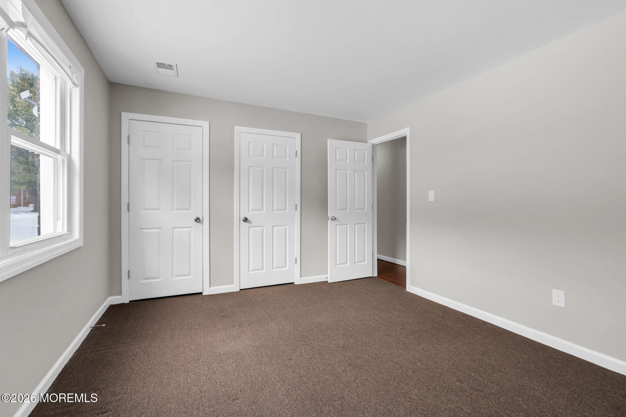 306 Sawmill Road, Unit 182 Brick, NJ 08724 - Photo 21 of 24 an empty room with windows