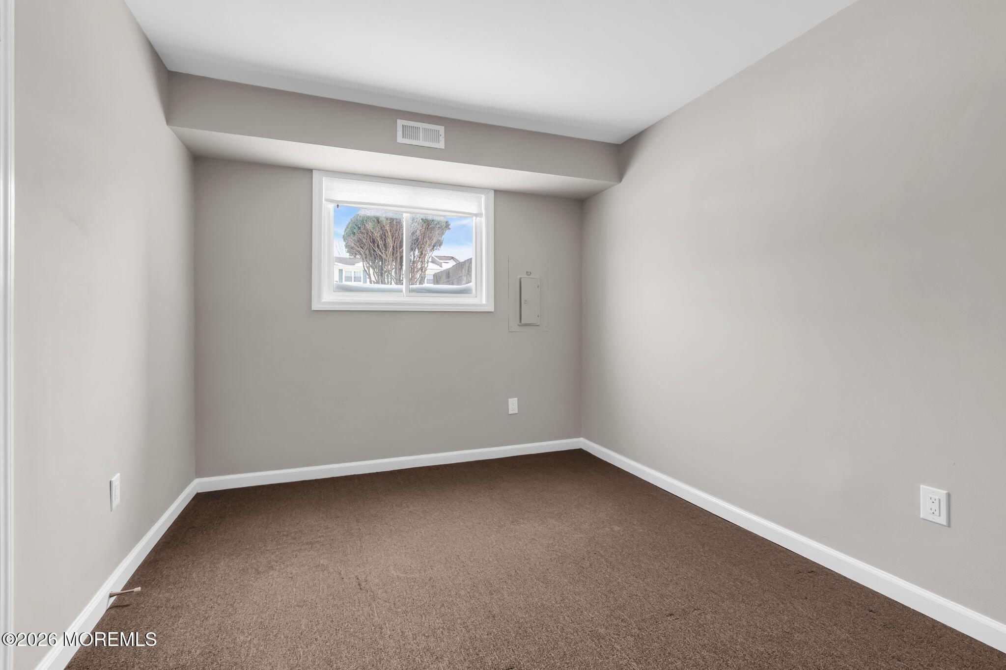306 Sawmill Road, Unit 182 Brick, NJ 08724 - Photo 22 of 24 an empty room with a window