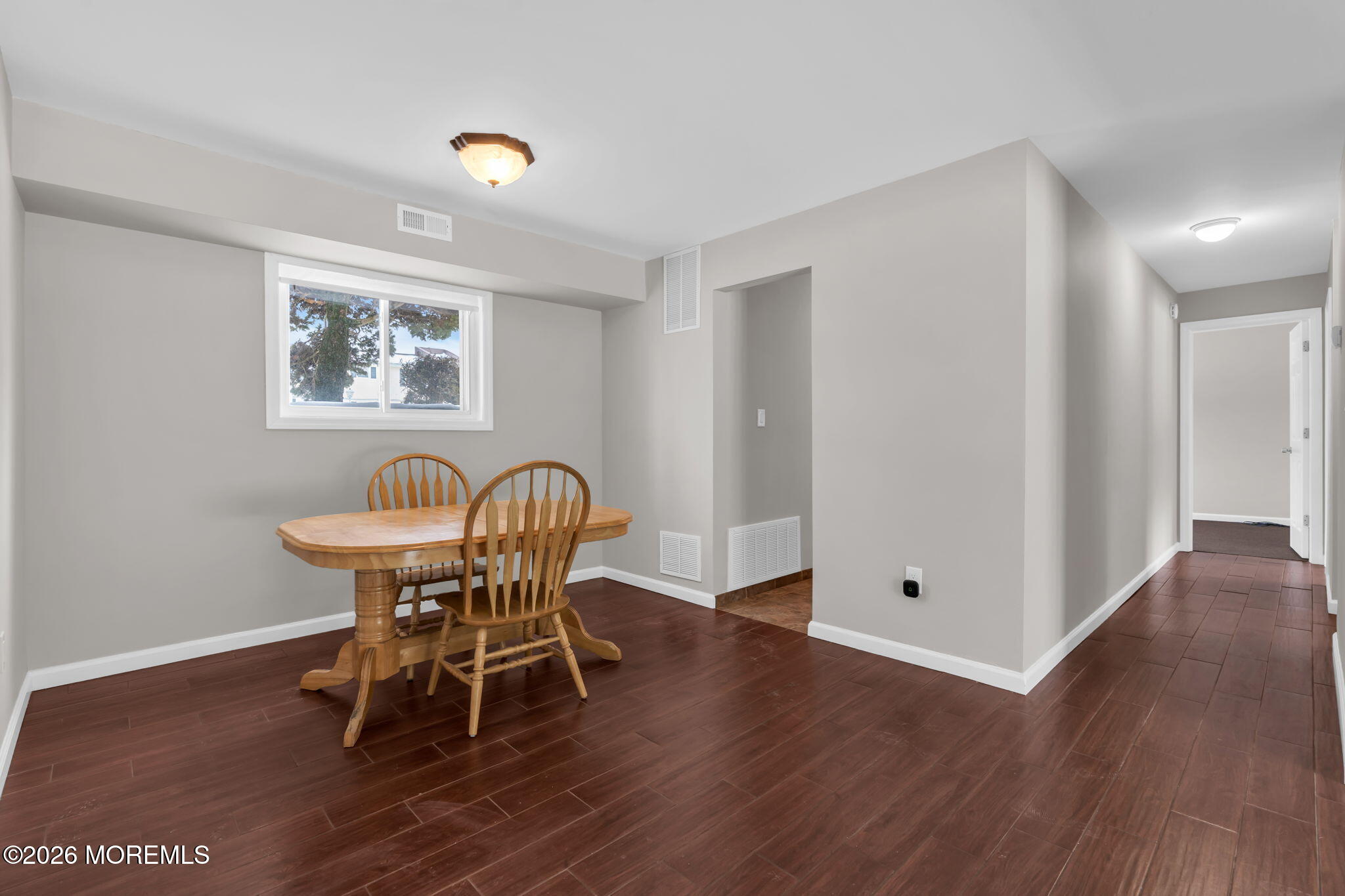 306 Sawmill Road, Unit 182 Brick, NJ 08724 - Photo 4 of 24 a view of a dining room with furniture and wooden floor