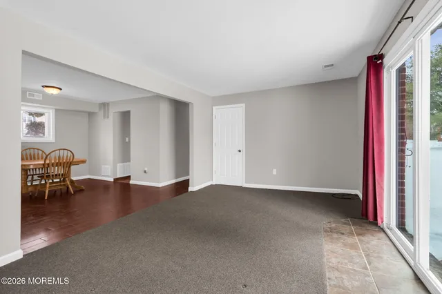 a view of livingroom with furniture and a window