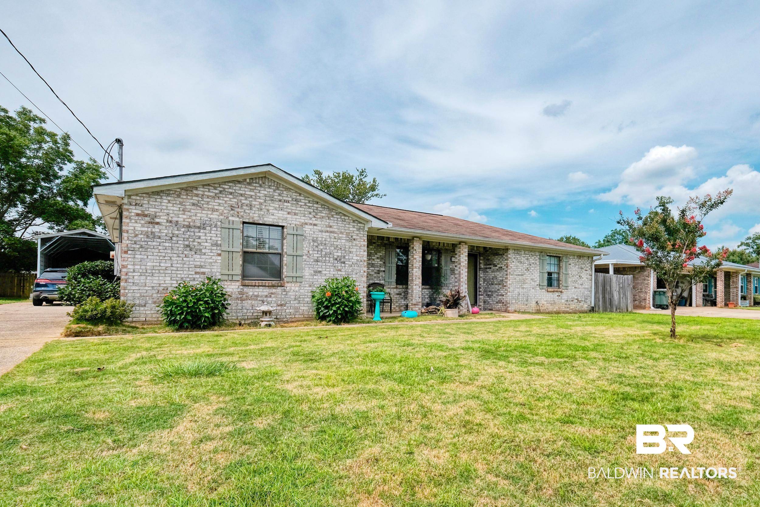 504 Ariel Avenue Foley, AL 36535 - Photo 1 of 33 Single story home featuring a front yard