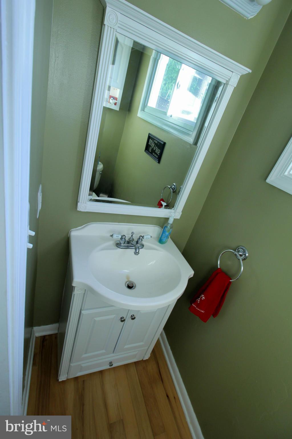 7308 Inzer Street Springfield, VA 22151 - Photo 14 of 30 a bathroom with a sink and mirror