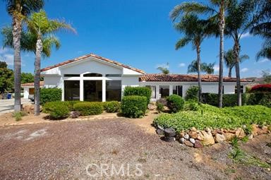 3786 Foxglove Lane Fallbrook, CA 92028 - Photo 1 of 34 a front view of a house with a garden