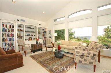3786 Foxglove Lane Fallbrook, CA 92028 - Photo 14 of 34 a living room with furniture and a floor to ceiling window