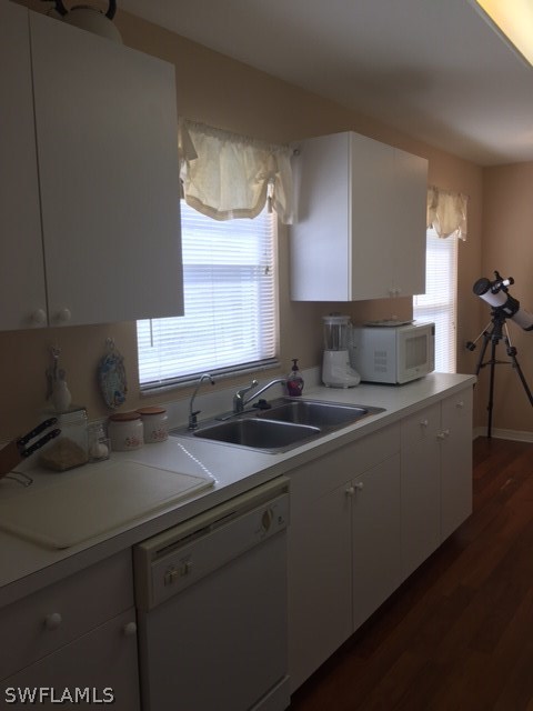 15699 Spring Line Lane Fort Myers, FL 33905 - Photo 3 of 12 a kitchen with stainless steel appliances granite countertop a sink stove and cabinets