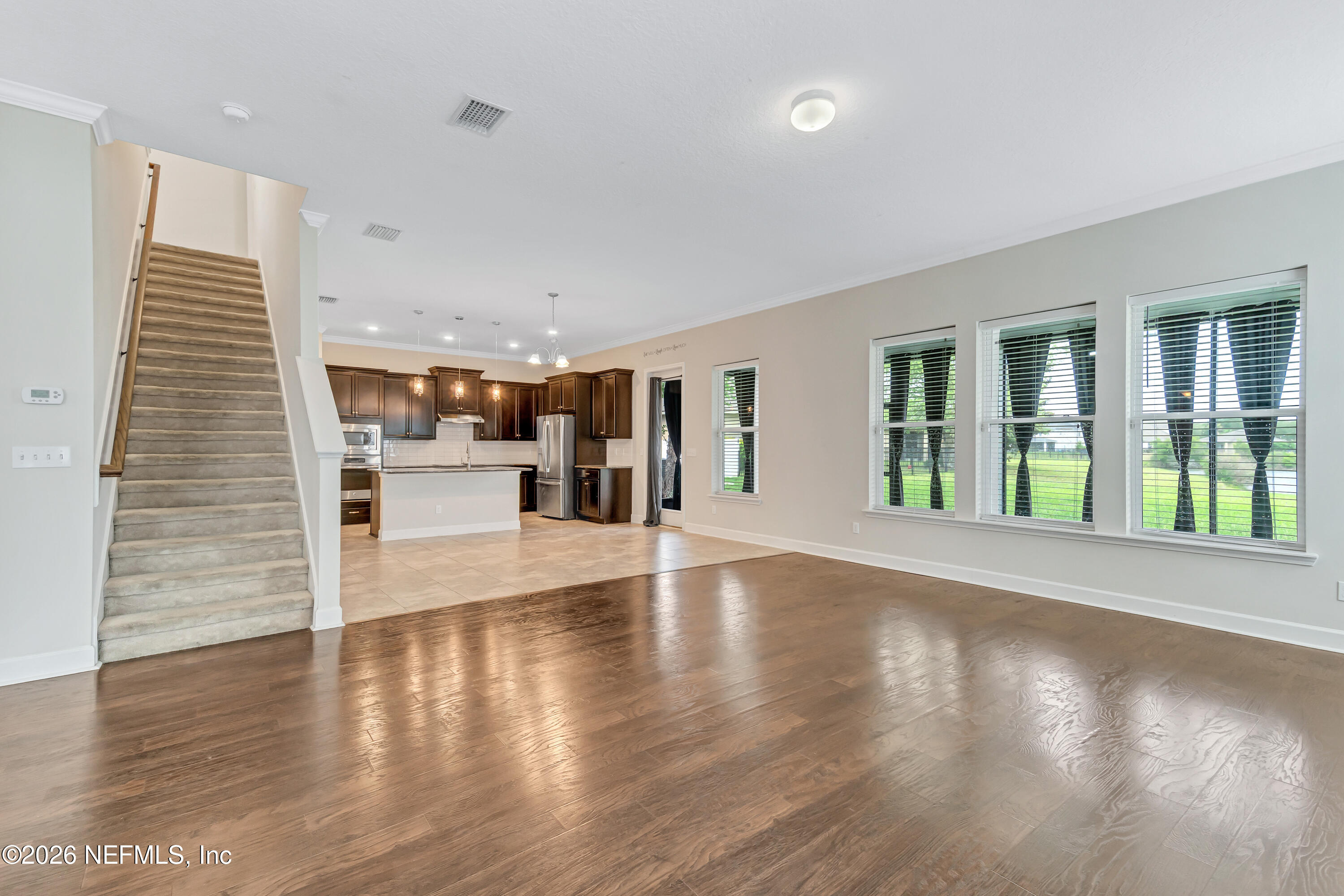 15715 Tisons Bluff Road Jacksonville, FL 32218 - Photo 18 of 48 a view of an entryway with wooden floor and windows