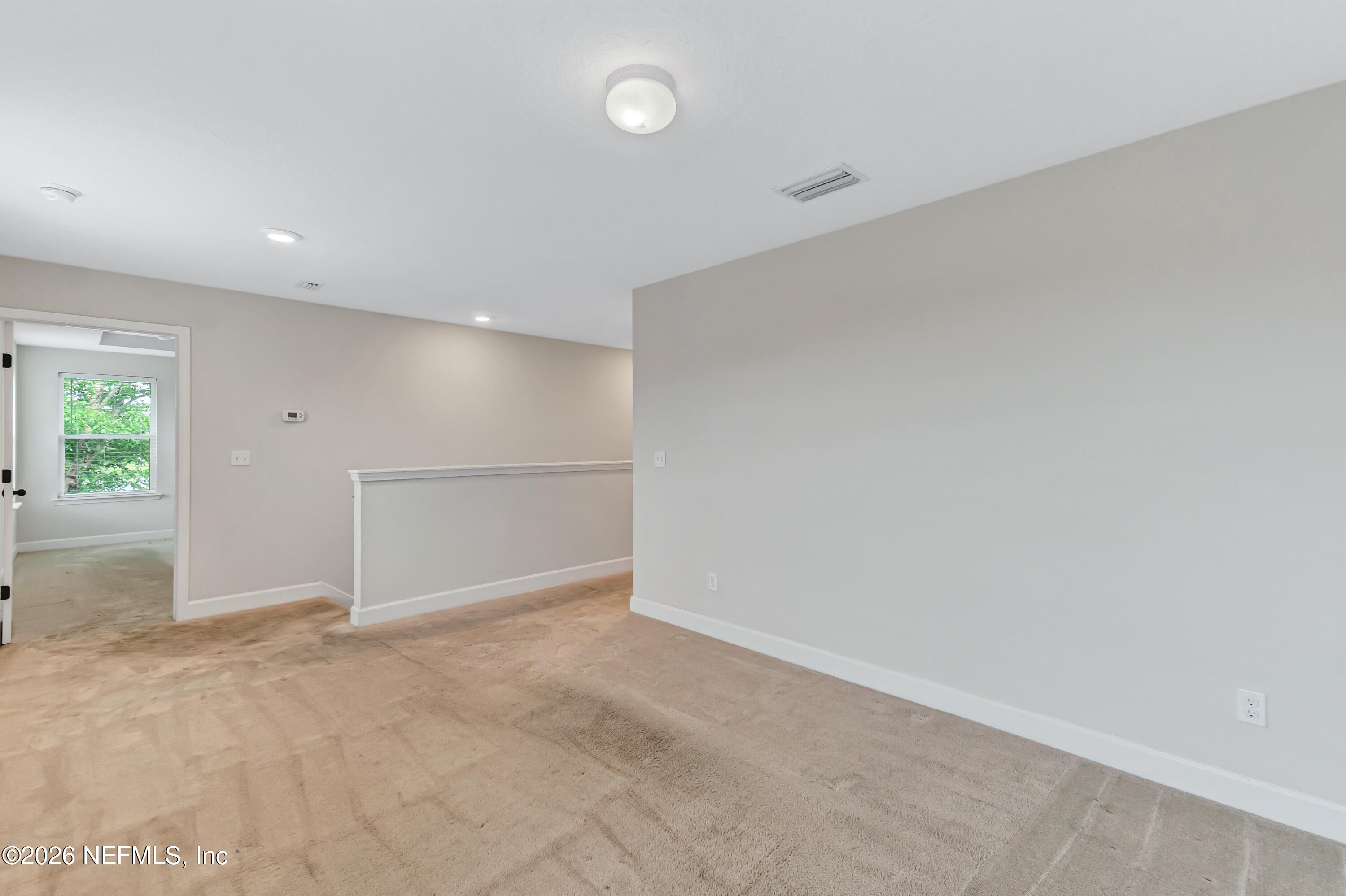 15715 Tisons Bluff Road Jacksonville, FL 32218 - Photo 21 of 48 an empty room with windows