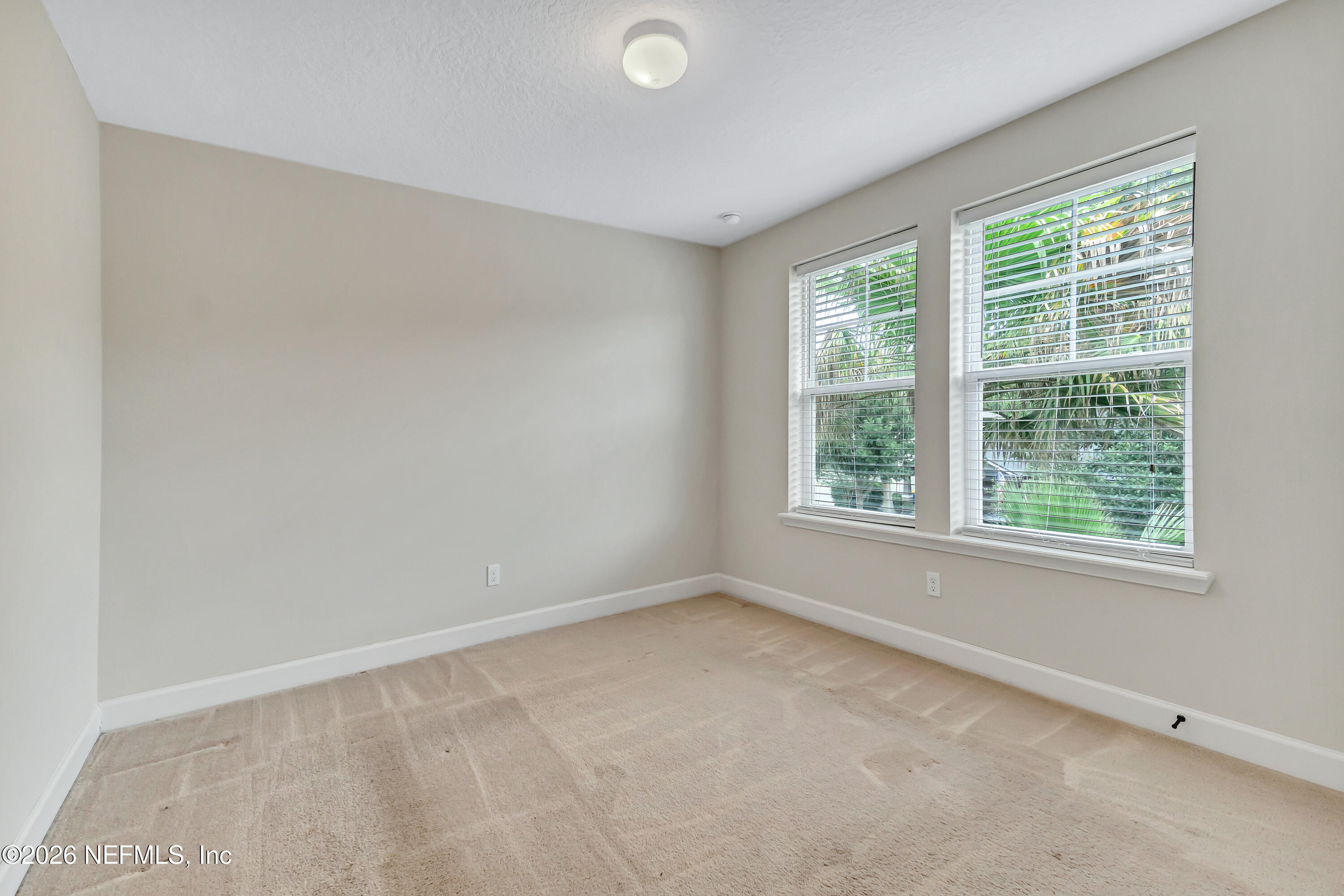 15715 Tisons Bluff Road Jacksonville, FL 32218 - Photo 26 of 48 an empty room with a window