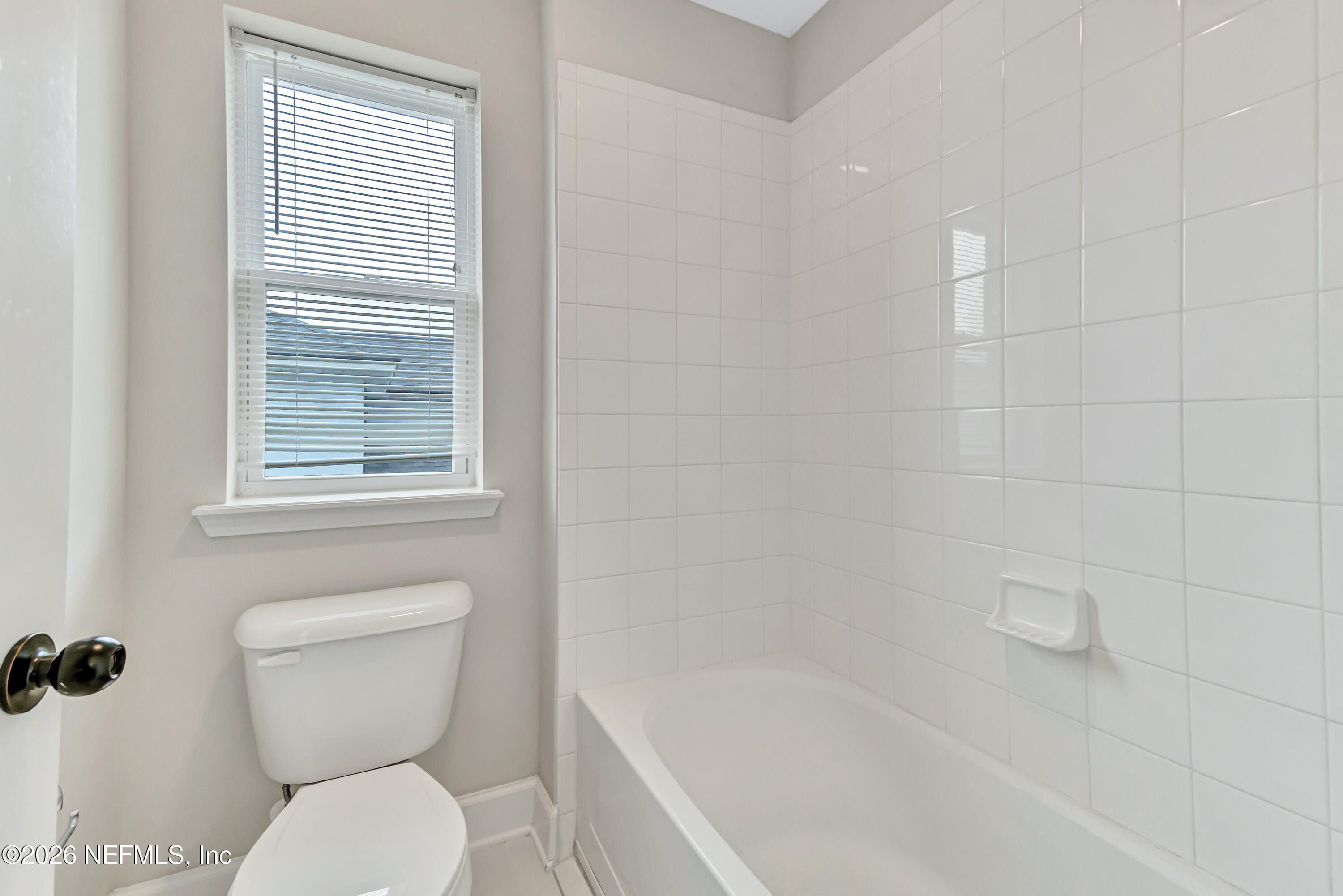 15715 Tisons Bluff Road Jacksonville, FL 32218 - Photo 30 of 48 a white toilet sitting next to a bath tub