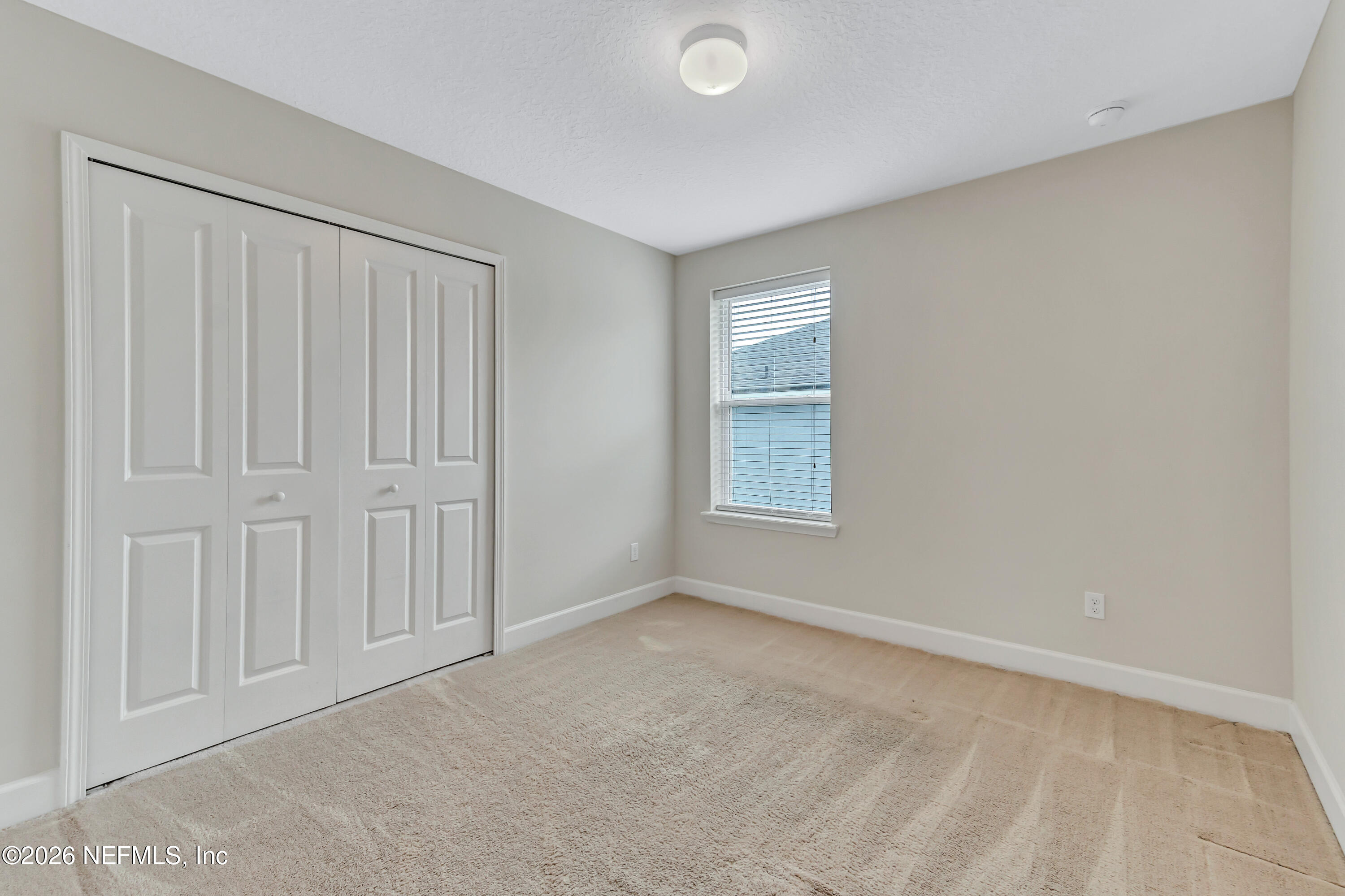 15715 Tisons Bluff Road Jacksonville, FL 32218 - Photo 31 of 48 an empty room with windows