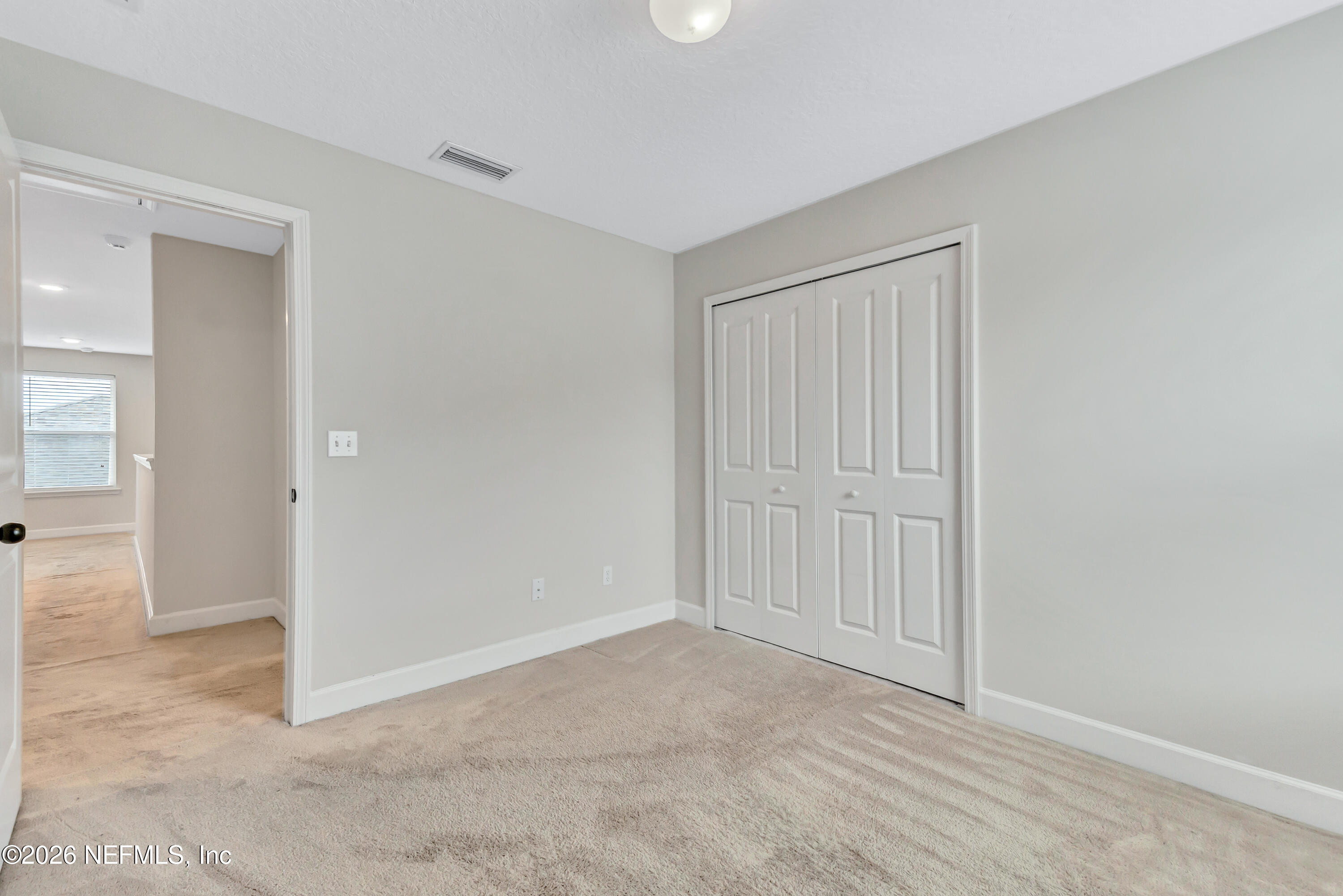 15715 Tisons Bluff Road Jacksonville, FL 32218 - Photo 33 of 48 an empty room with closet area