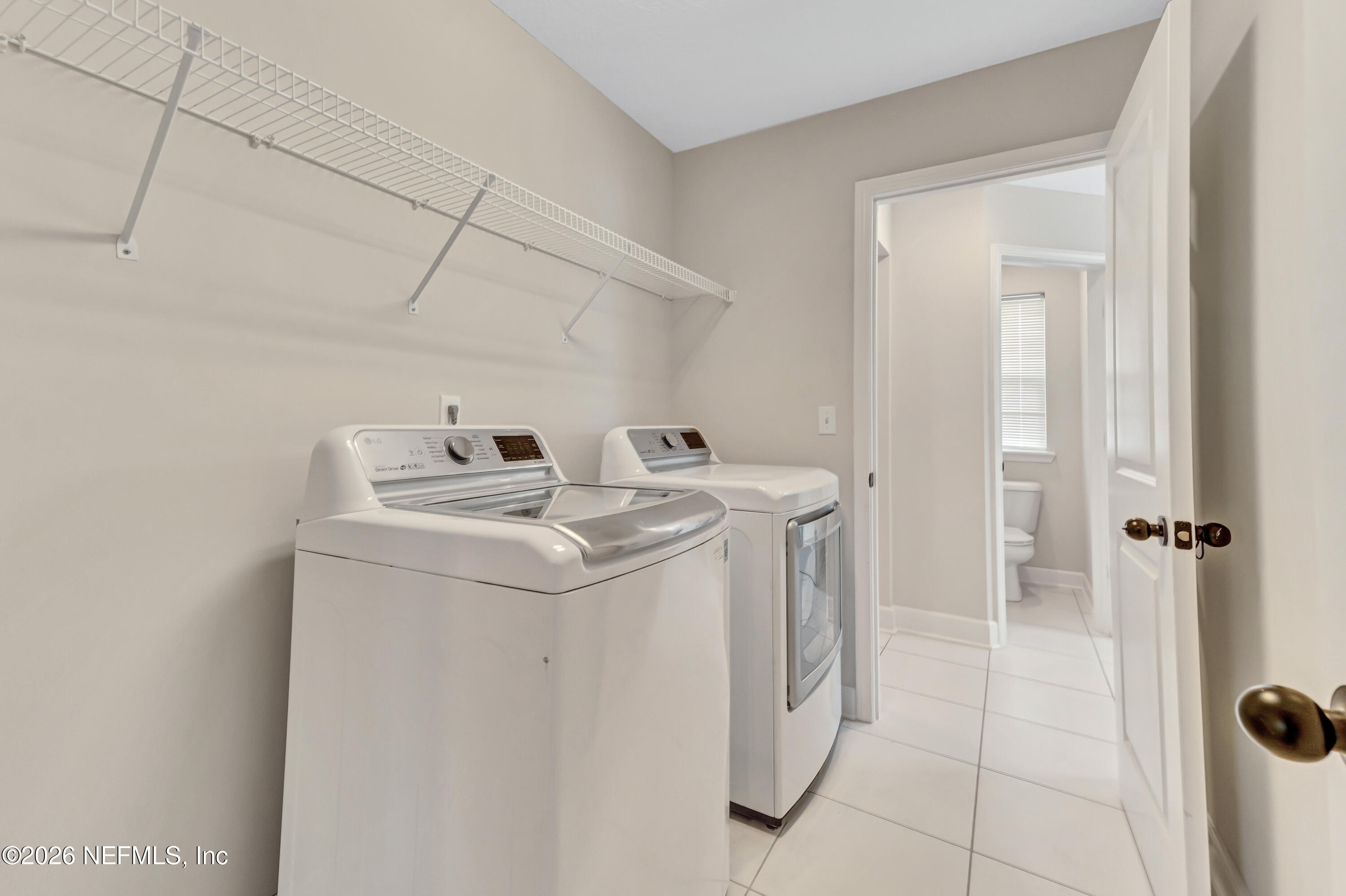 15715 Tisons Bluff Road Jacksonville, FL 32218 - Photo 34 of 48 a utility room with dryer and washer