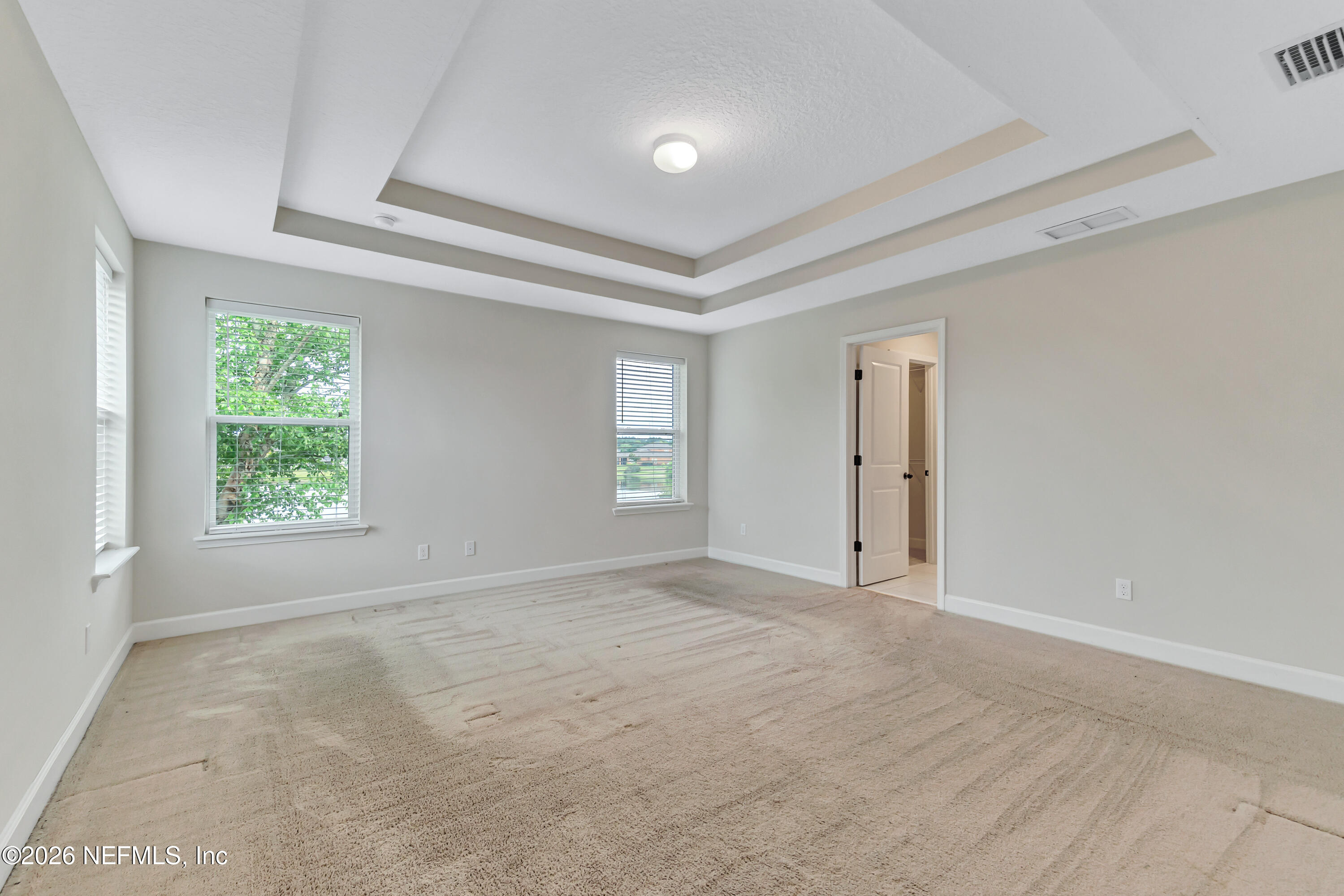 15715 Tisons Bluff Road Jacksonville, FL 32218 - Photo 35 of 48 an empty room with windows and closet