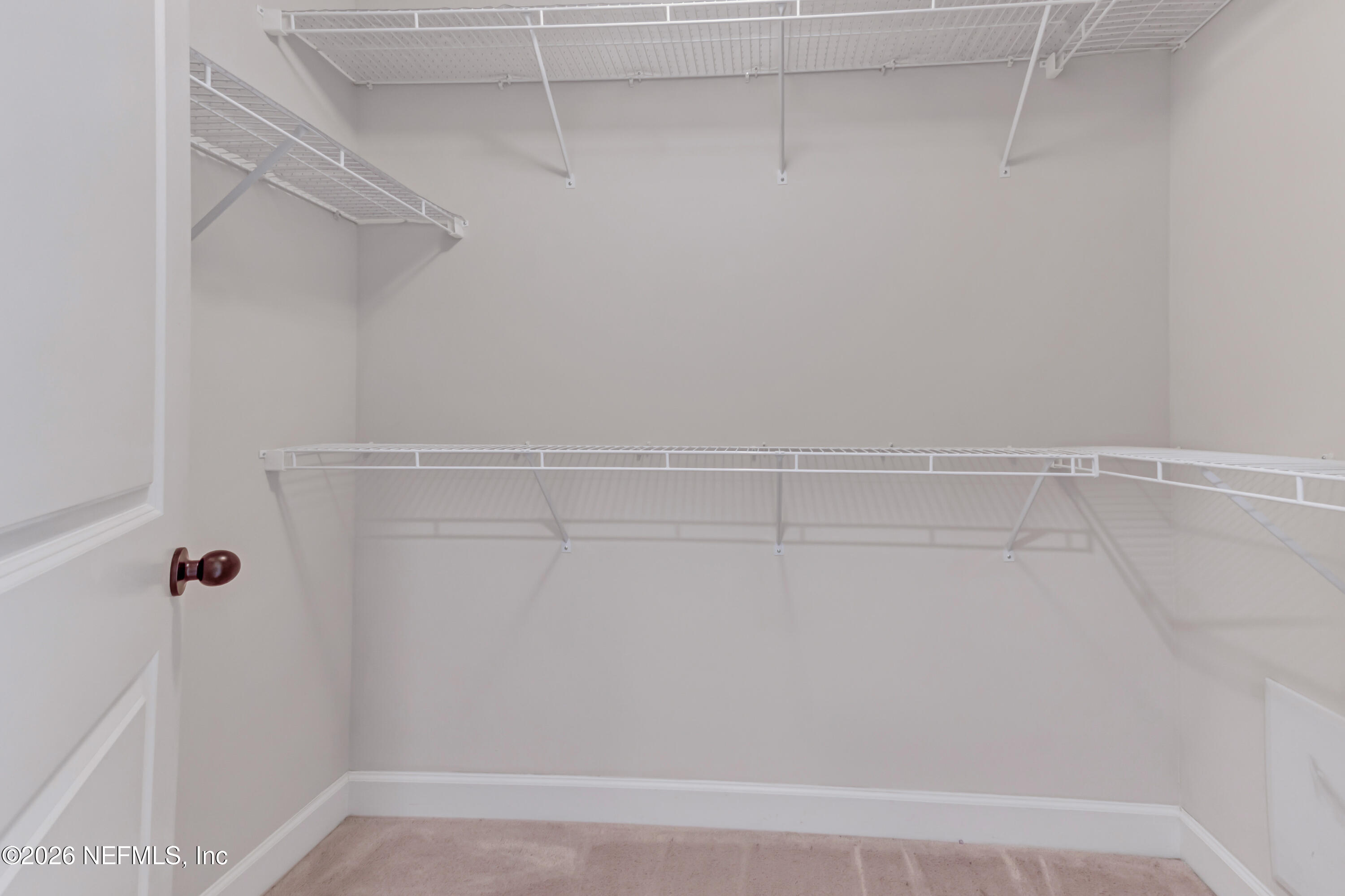 15715 Tisons Bluff Road Jacksonville, FL 32218 - Photo 40 of 48 a view of a room with racks on the wall