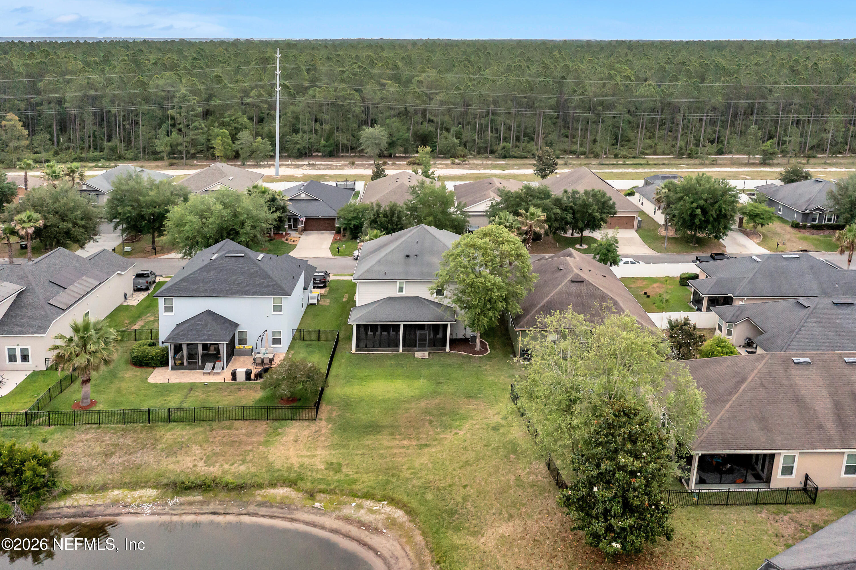 15715 Tisons Bluff Road Jacksonville, FL 32218 - Photo 4 of 48 an aerial view of residential houses with outdoor space and lake view