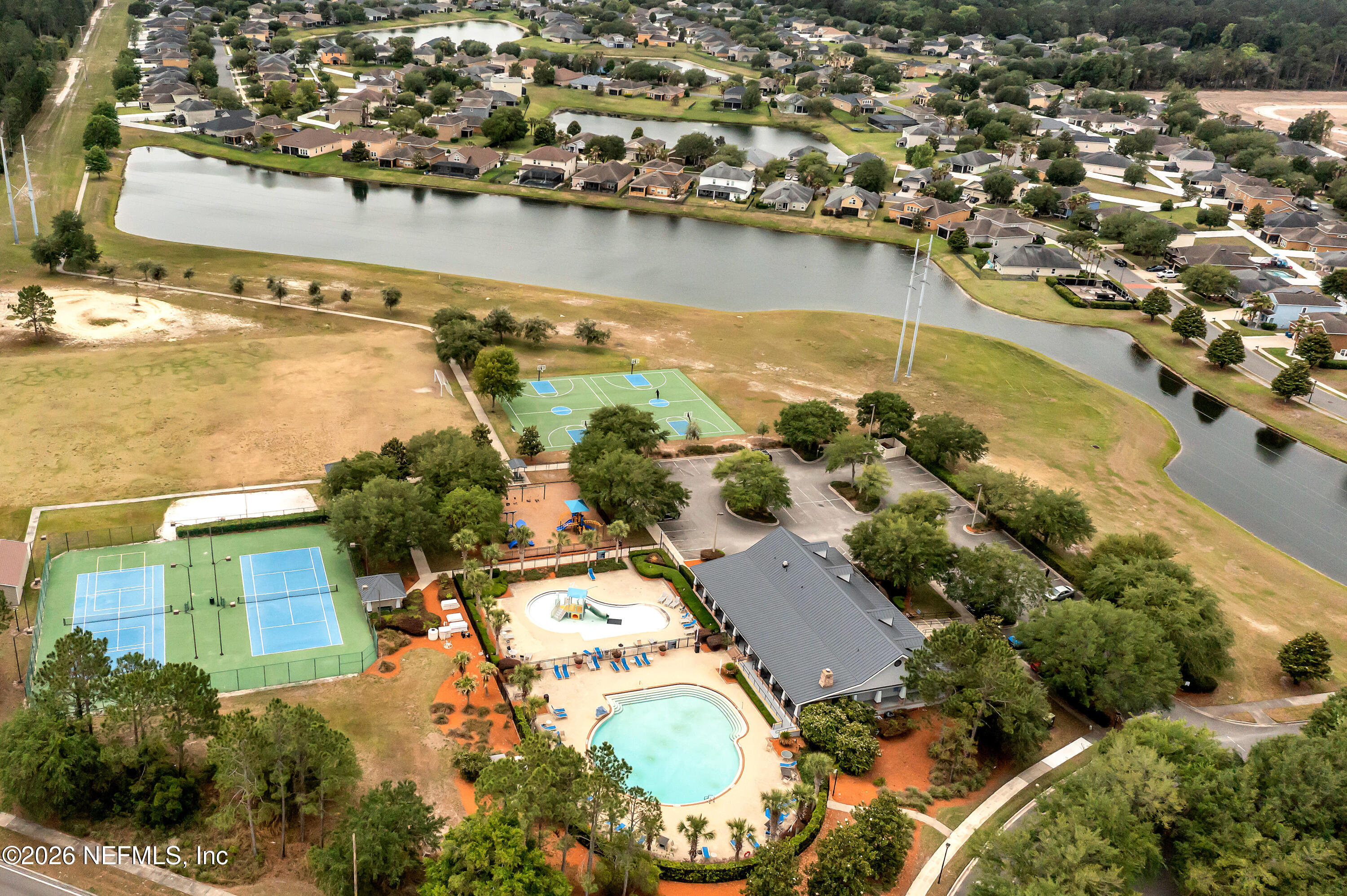 15715 Tisons Bluff Road Jacksonville, FL 32218 - Photo 44 of 48 an aerial view of residential houses with outdoor space