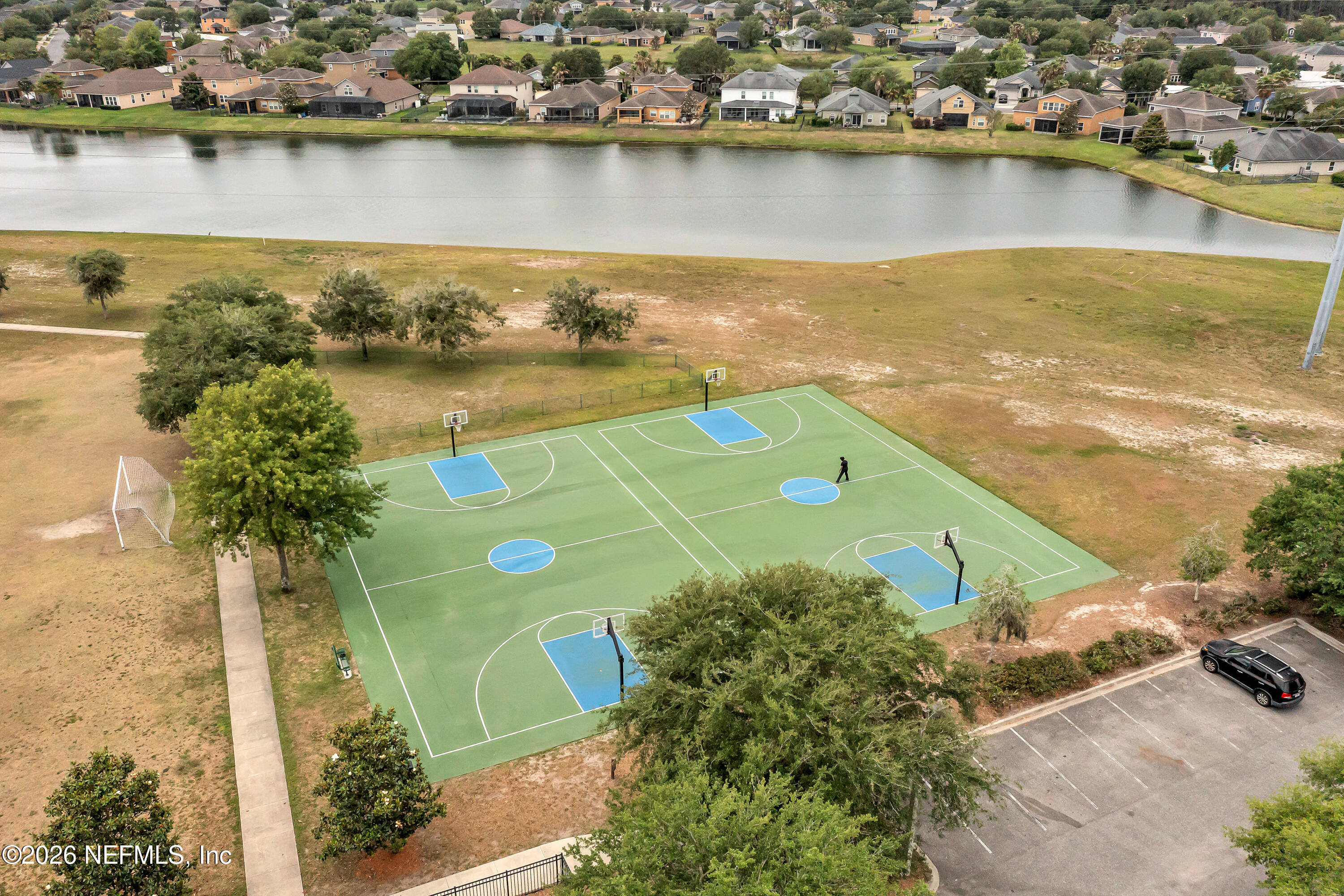 15715 Tisons Bluff Road Jacksonville, FL 32218 - Photo 45 of 48 an aerial view of a city with a lake view