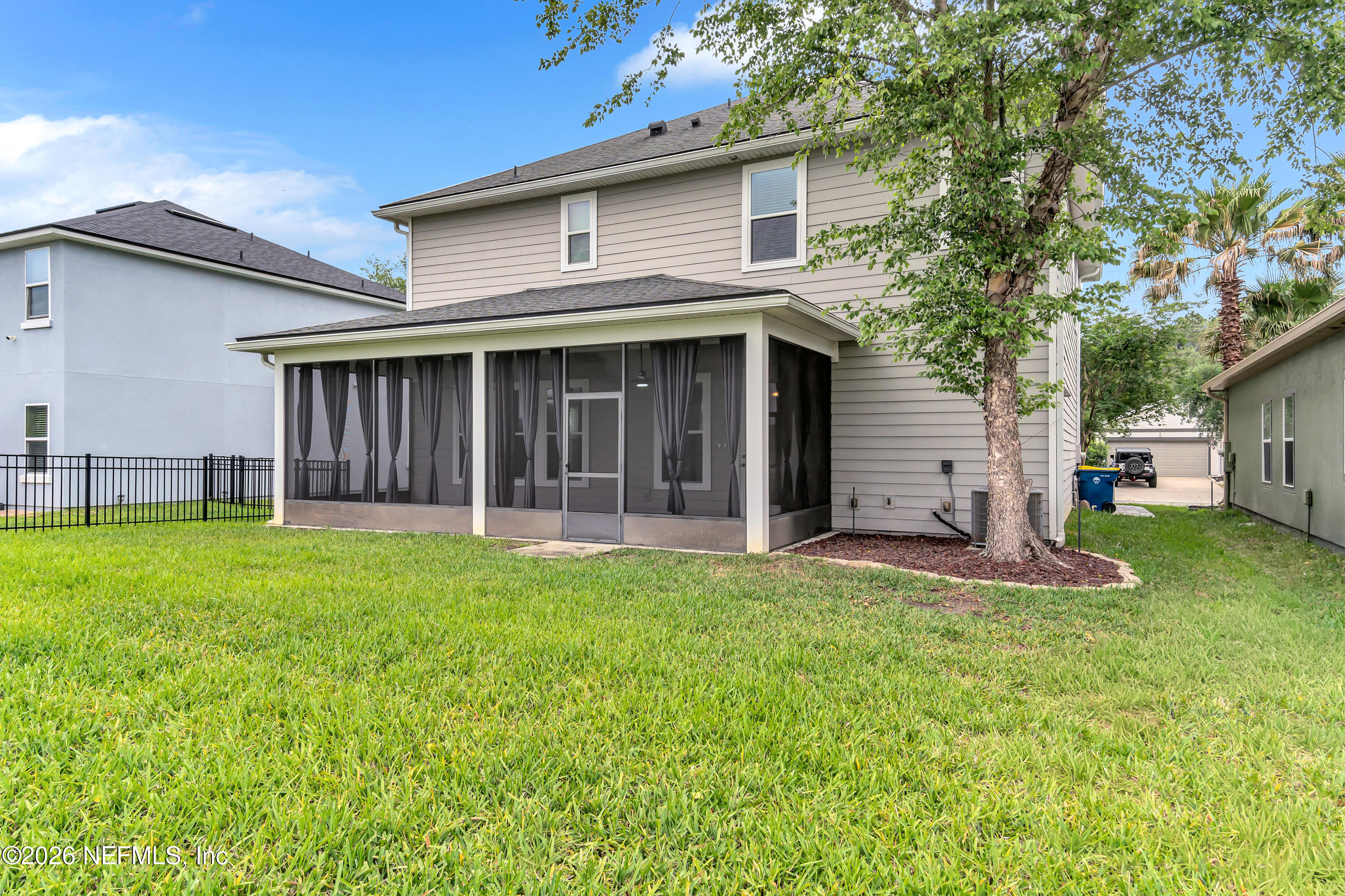 15715 Tisons Bluff Road Jacksonville, FL 32218 - Photo 8 of 48 a view of a house with a yard and garage