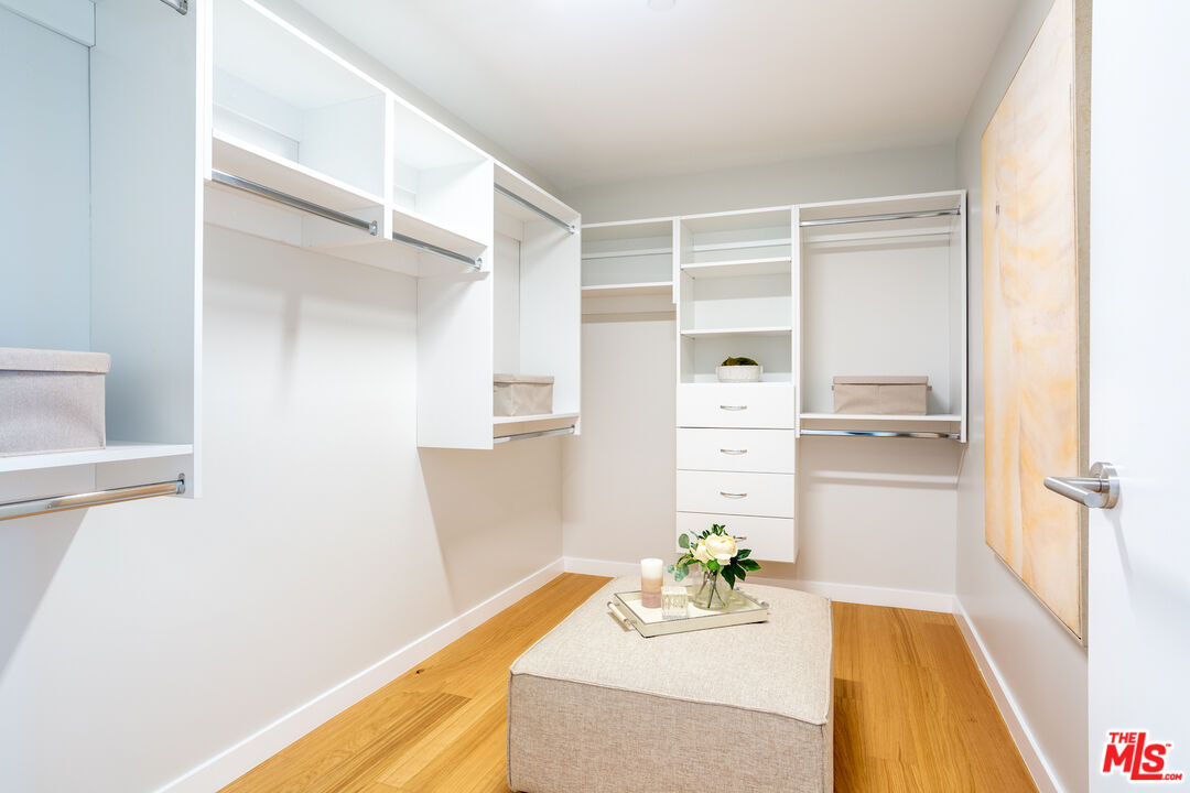 11600 Dunstan Way, Unit 214 Los Angeles, CA 90049 - Photo 9 of 12 a bathroom with a bathtub and a shower