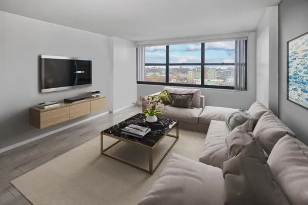 a living room with furniture a flat screen tv and a large window