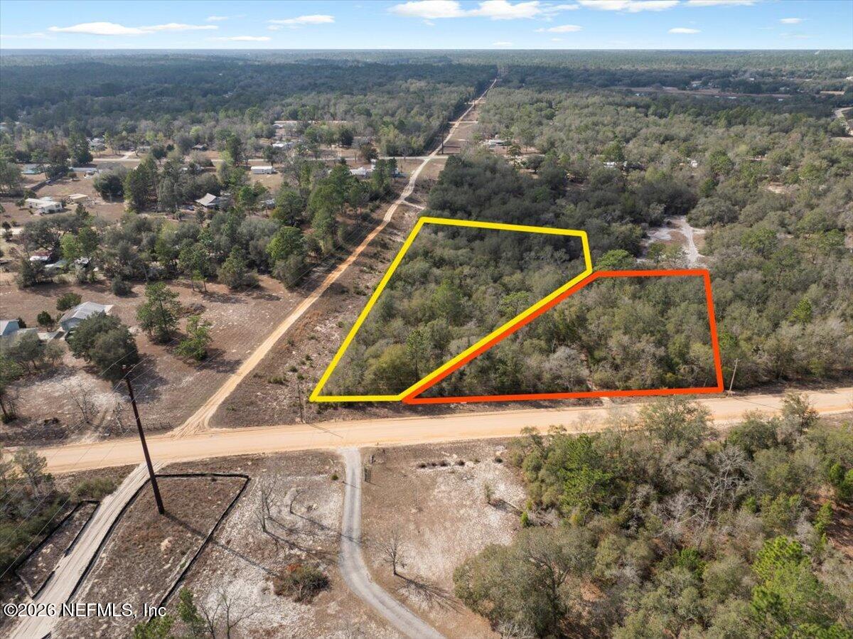 7678 Oak Forest Road Keystone Heights, FL 32656 - Photo 11 of 27 a view of a tennis ground with large trees