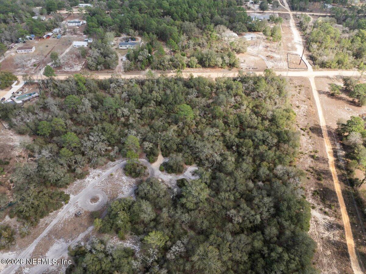7678 Oak Forest Road Keystone Heights, FL 32656 - Photo 23 of 27 a view of a forest with a building