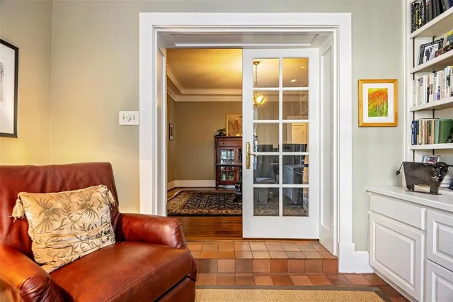 a bedroom with furniture and a window