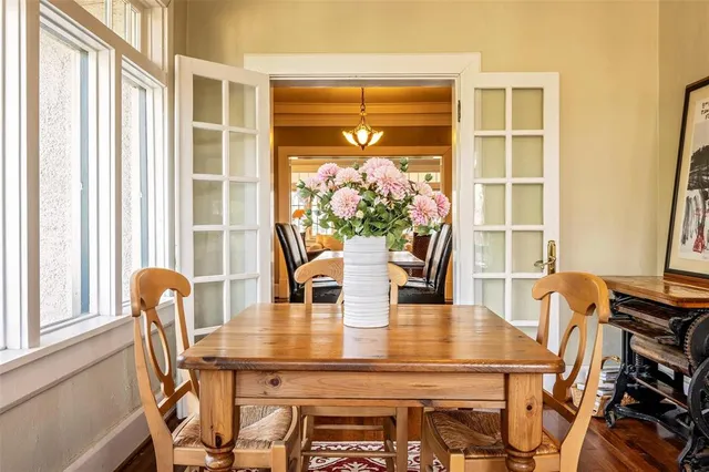 a view of a dining room with furniture and window