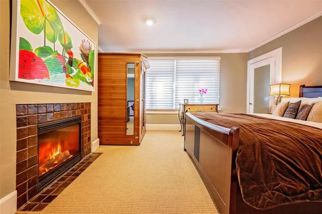 a bedroom with a bed and a fireplace