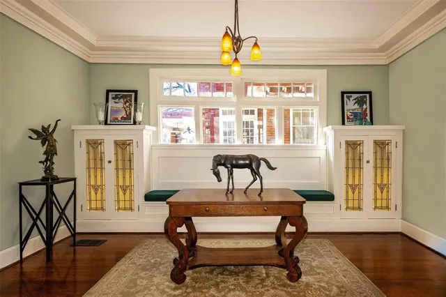 a view of a livingroom with furniture window and wooden floor