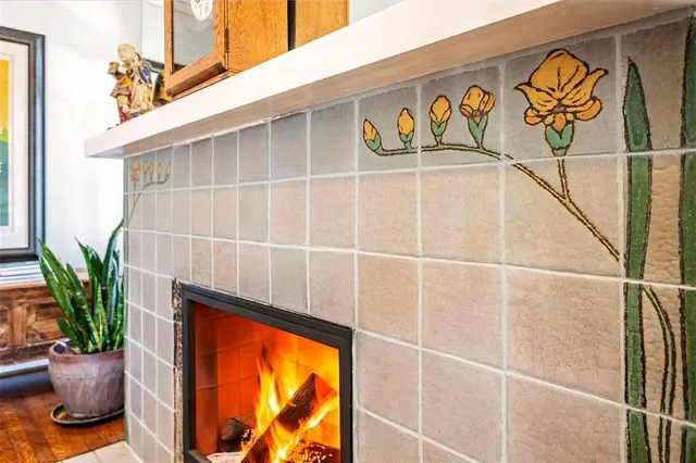 a glass door with a potted plant on the wall