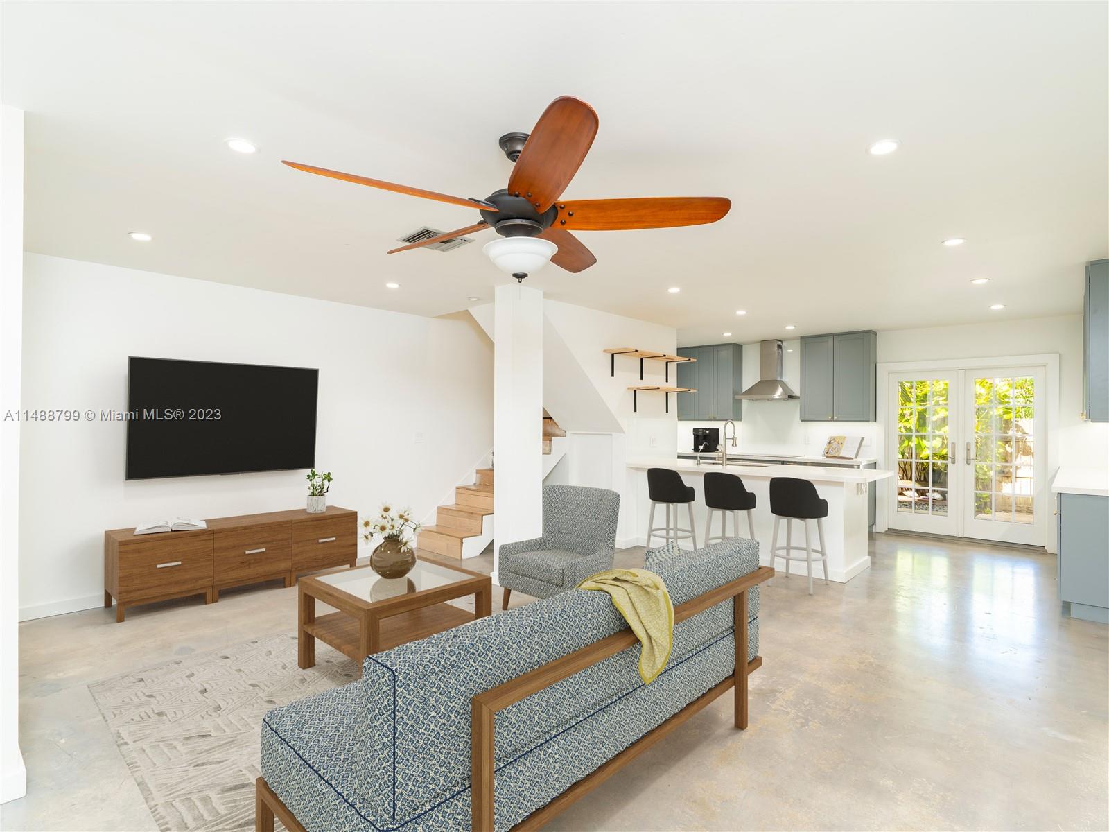 8236 Southwest 103rd Avenue Miami, FL 33173 - Photo 1 of 24 a living room with furniture and a flat screen tv