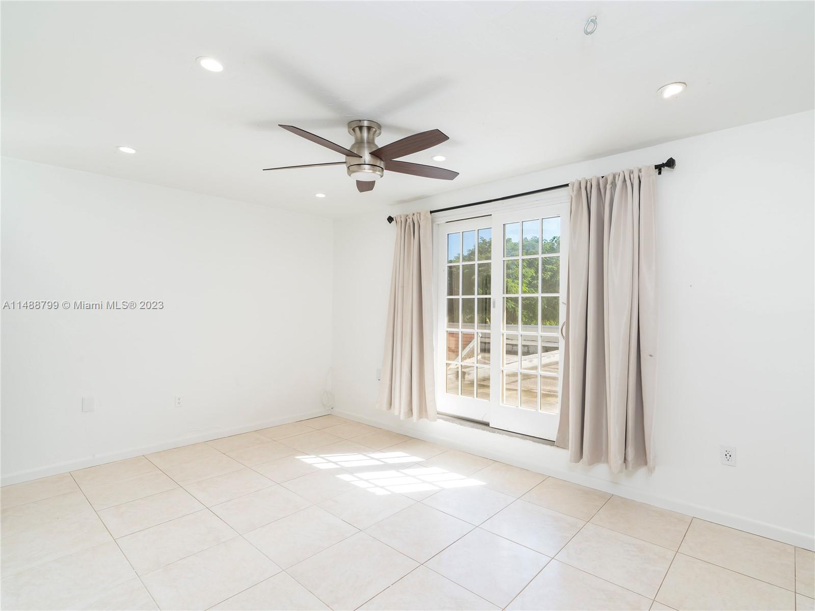 8236 Southwest 103rd Avenue Miami, FL 33173 - Photo 13 of 24 a view of an empty room with a window