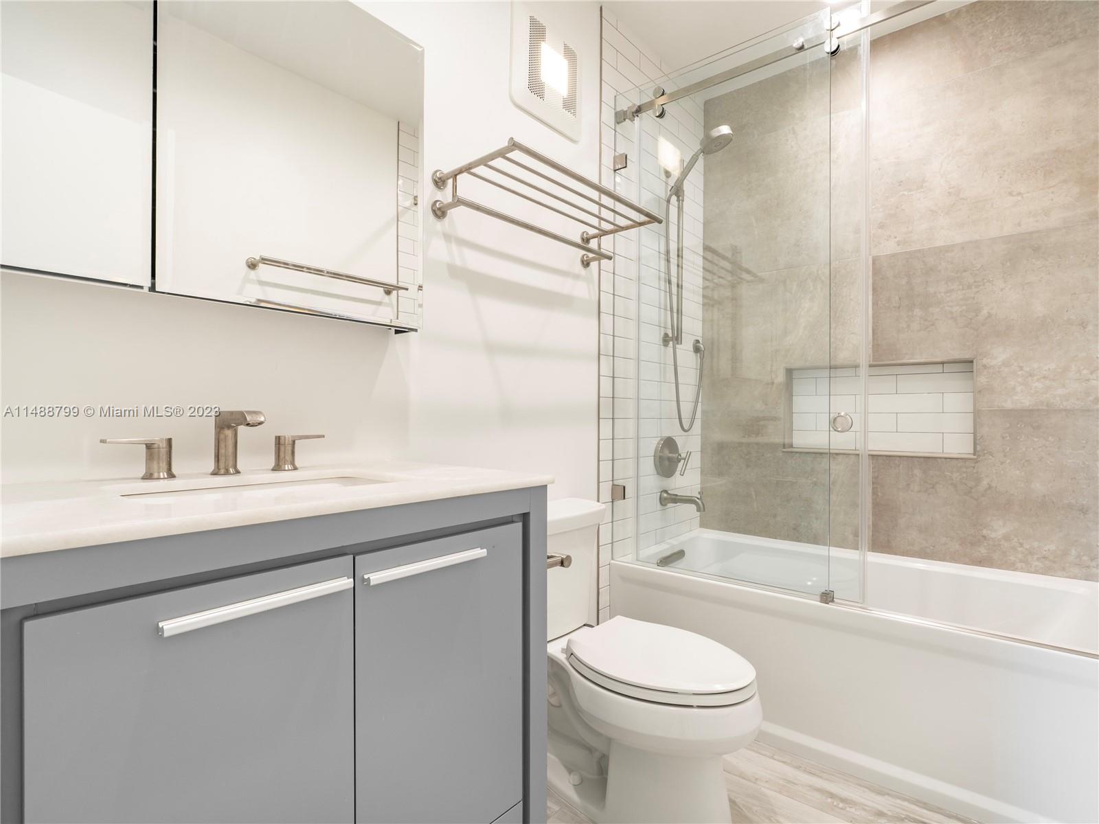 8236 Southwest 103rd Avenue Miami, FL 33173 - Photo 17 of 24 a bathroom with a sink a toilet and a bathtub