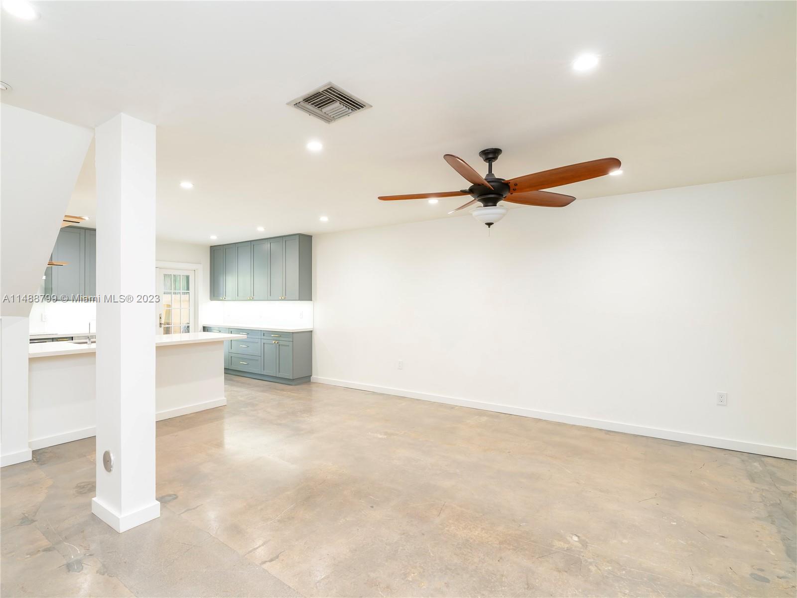 8236 Southwest 103rd Avenue Miami, FL 33173 - Photo 4 of 24 a view of a kitchen with a sink and a refrigerator