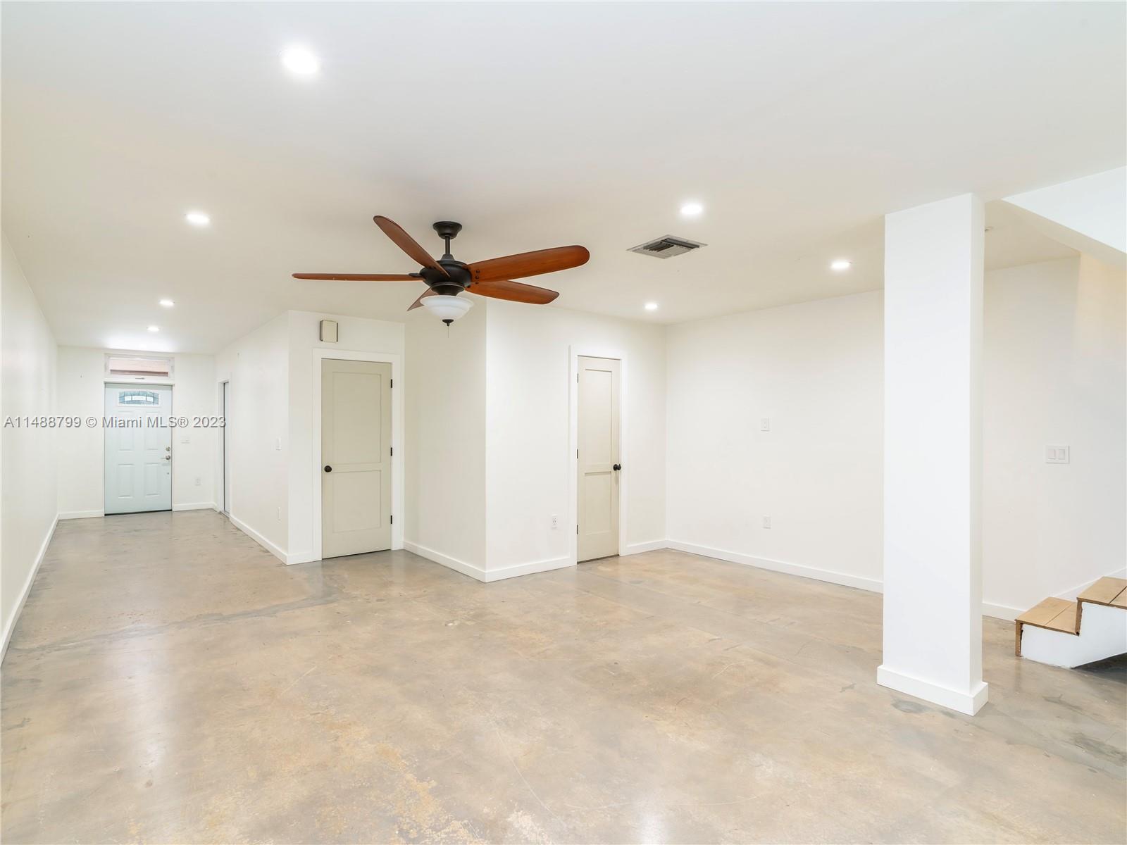 8236 Southwest 103rd Avenue Miami, FL 33173 - Photo 6 of 24 a view of a livingroom with a ceiling fan and window