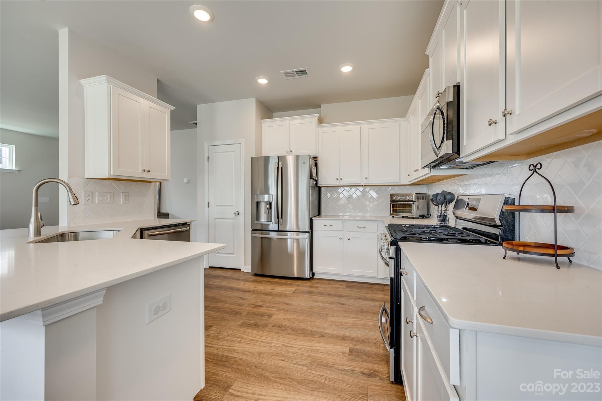 6500 Gopher Road Lancaster, SC 29720 - Photo 8 of 38 a kitchen with refrigerator and cabinets
