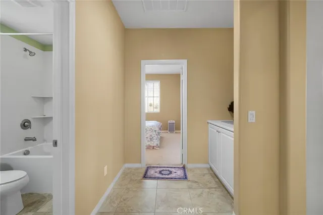 a bathroom with a glass door shower
