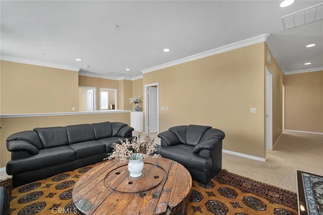 a view of a bedroom with a bed and a large mirror