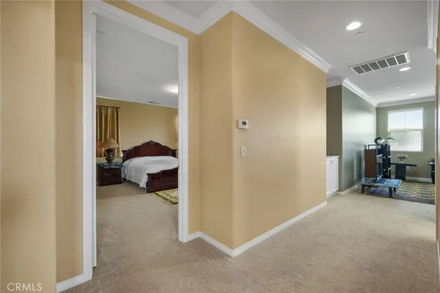 a bedroom with a bed and glass window