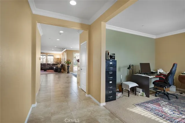 a view of a livingroom with couch and a workspace